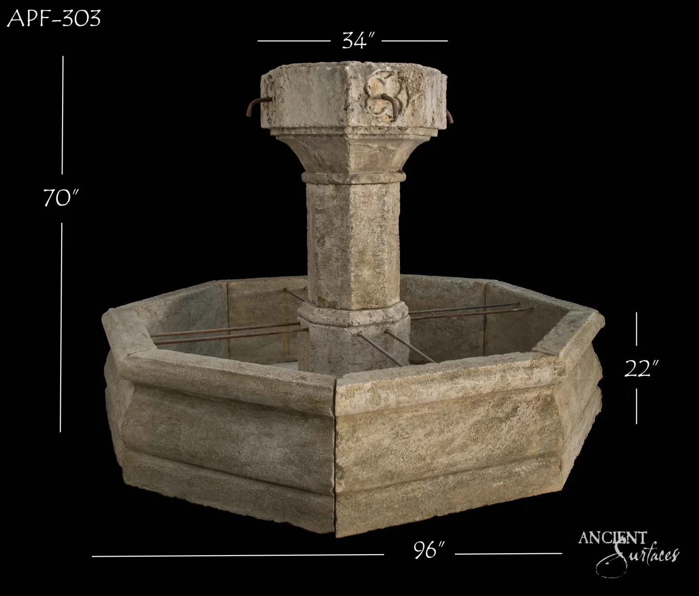 Wide octagonal reclaimed antique limestone pool fountain from Ancient Surfaces with a slim shaft and an eight sided capital drum carved with scrolled foliate relief, two iron spouts and grey green weathered basin panels